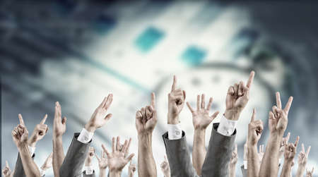 Group of people with hands up showing gesturesの写真素材