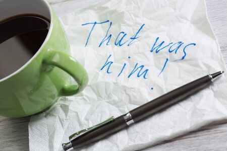 Message written on napkin and coffee cup on wooden napkinの写真素材