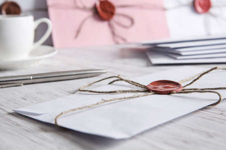 Old post concept with envelope with wax seal on wooden surfaceの写真素材