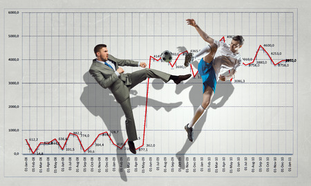 Football player hitting ball and progress infographs at backgroundの写真素材