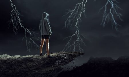 Young boxer woman standing outdoors against city landscape