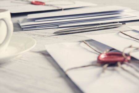 Old post concept with envelope with wax seal on wooden surfaceの写真素材