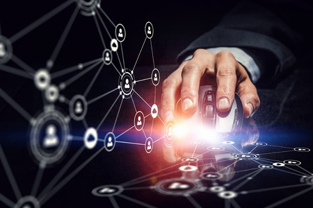 Hand of businessman on dark 3D rendering background using wireless mouse