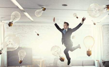 Funny jumping businessman in modern 3D rendering interior. Mixed mediaの写真素材