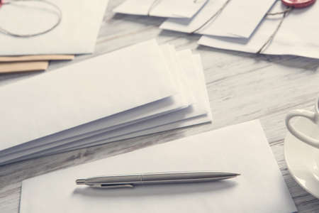 Old post concept with envelope with wax seal on wooden surfaceの写真素材