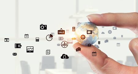 Female hand holding Earth planet between fingers. Elements of this image are furnished