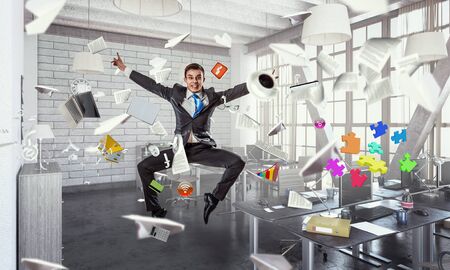 Funny jumping businessman in modern 3D rendering interior. Mixed mediaの写真素材