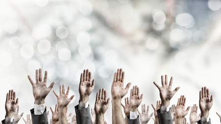 Group of people with hands up showing gesturesの写真素材