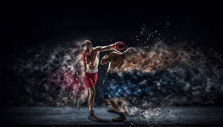 Two strong fighters outdoor demonstrating ultimate fightingの写真素材