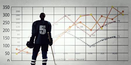 Ice hockey player and graphs at backgroundの写真素材