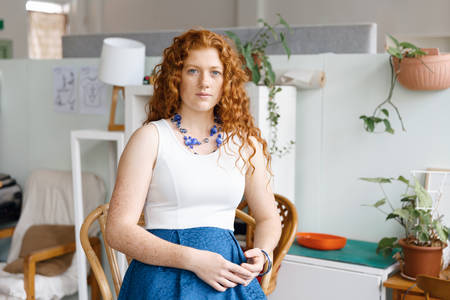 Young woman in casual clothes in an office