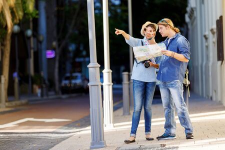 Young couple of tourists on the streets of a cityの写真素材