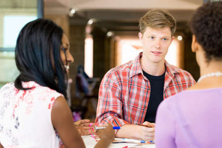 Young man in casual clothes in an office