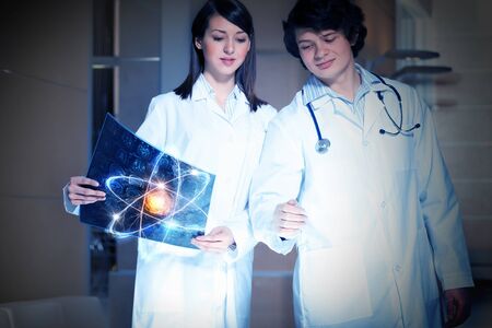 Two scientist carrying out research in laboratoryの写真素材