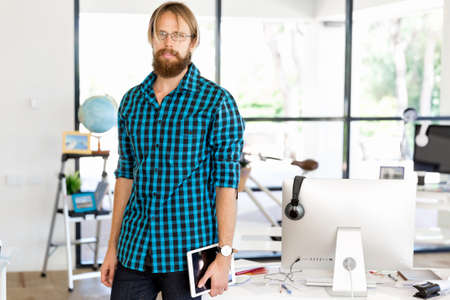 Young man in casual clothes in an office