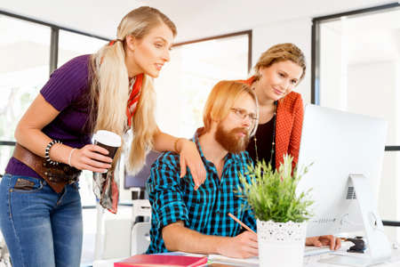 Creative young office workers working together and having discussion