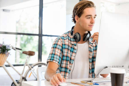 Young man in casual clothes in an office