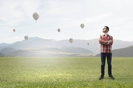 Man in checked shirt and eyeglasses outdoorsの写真素材
