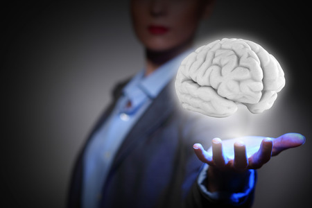 Close view of businesswoman holding in palm human brain
