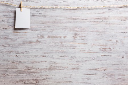 Sheet of old paper hang on clothesline. Place your textの写真素材