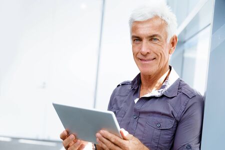 Handsome businessman in casual wear working in office