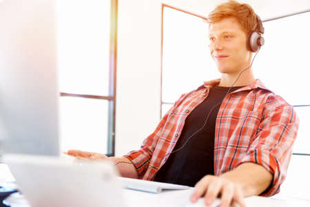 Young man in casual clothes in an office