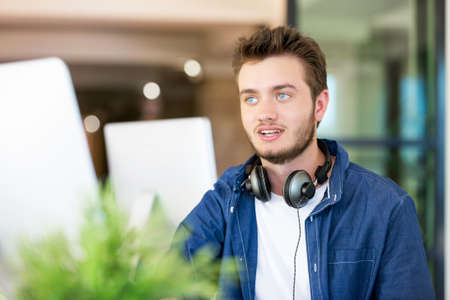 Young man in casual clothes in an office