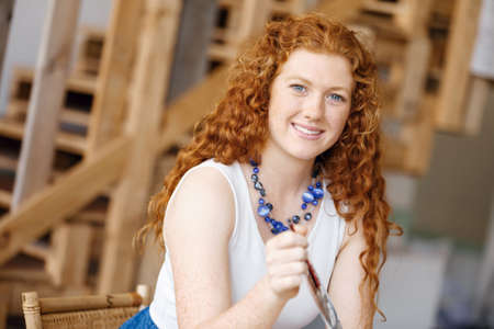 Young woman designer in casual clothes in an officeの写真素材