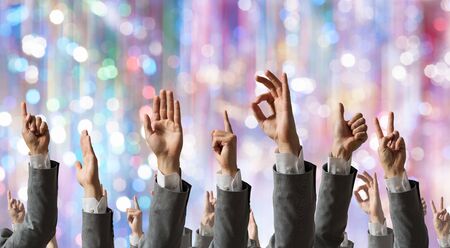 Group of people with hands up showing gesturesの写真素材