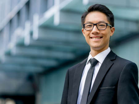 Businessman outdoors in city business districtの写真素材