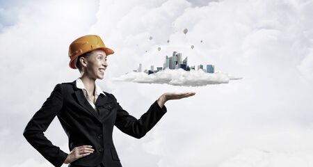 Attractive engineer woman presenting in palm construction projectの写真素材