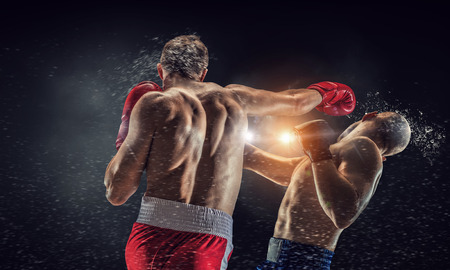 Two strong fighters outdoor demonstrating ultimate fightingの写真素材