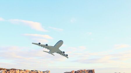 Airplane flying over blue sky at sunset