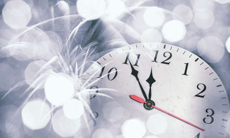 Background New Year conceptual image with clock showing five minutes to twelve