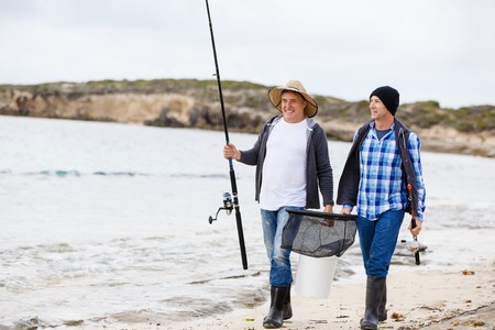Picture of fishermen fishing with rodsの写真素材