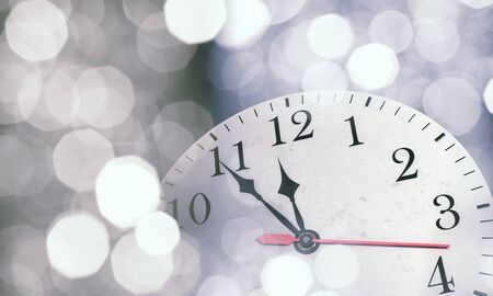 Background New Year conceptual image with clock showing five minutes to twelveの写真素材