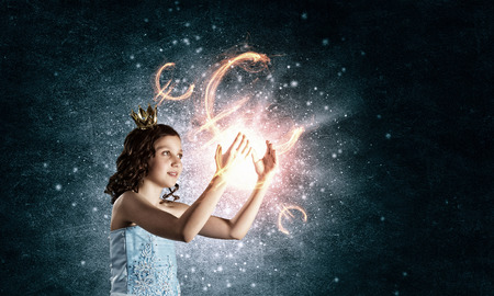 Little cute princess in dress and crownの写真素材