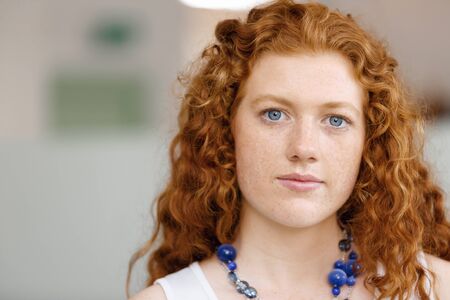 Young woman in casual clothes in an officeの写真素材