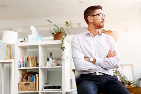 Young businessman standing in office