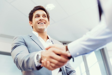 Handshake of businessmen greeting each otherの写真素材
