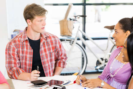 Young man in casual clothes in an office
