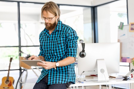 Young man in casual clothes in an officeの写真素材