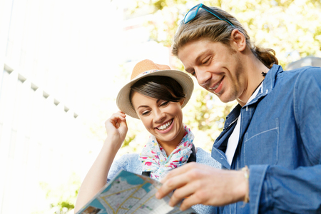 Young couple of tourists on the streets of a cityの写真素材