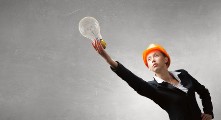Attractive woman engineer reaching hand in gesture