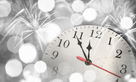 Background New Year conceptual image with clock showing five minutes to twelveの写真素材