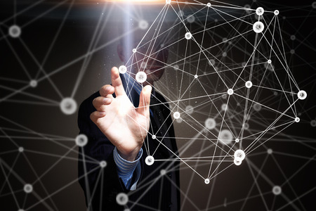 Hand of businessman presenting global modern technologies concept in palmの写真素材