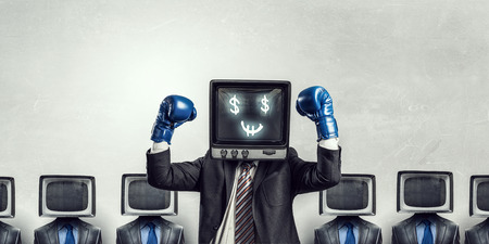 Unrecognizable businessman with monitor instead of head . Mixed mediaの写真素材