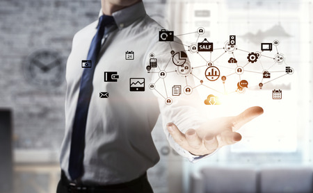Close up of businessman hand presenting in palm digital business strategy. 3D rendering . Mixed mediaの写真素材