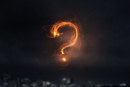 Question mark glowing symbol on dark background . Mixed mediaの写真素材