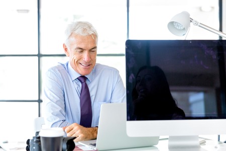 Handsome businessman at the officeの写真素材